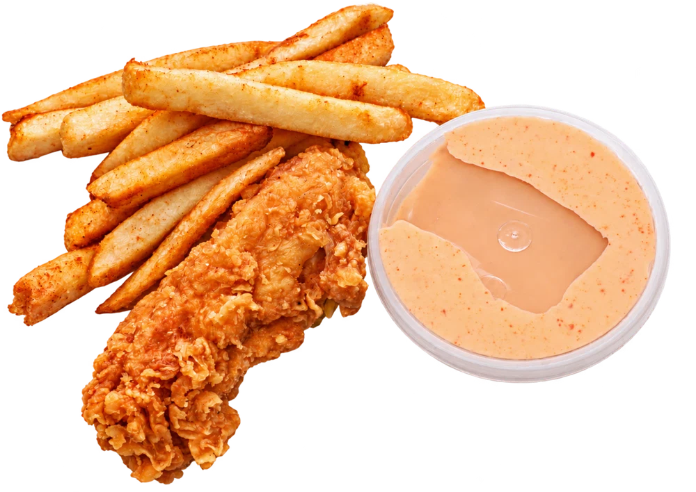 Crunchy Cheekies chicken strips with fries and a dipping sauce