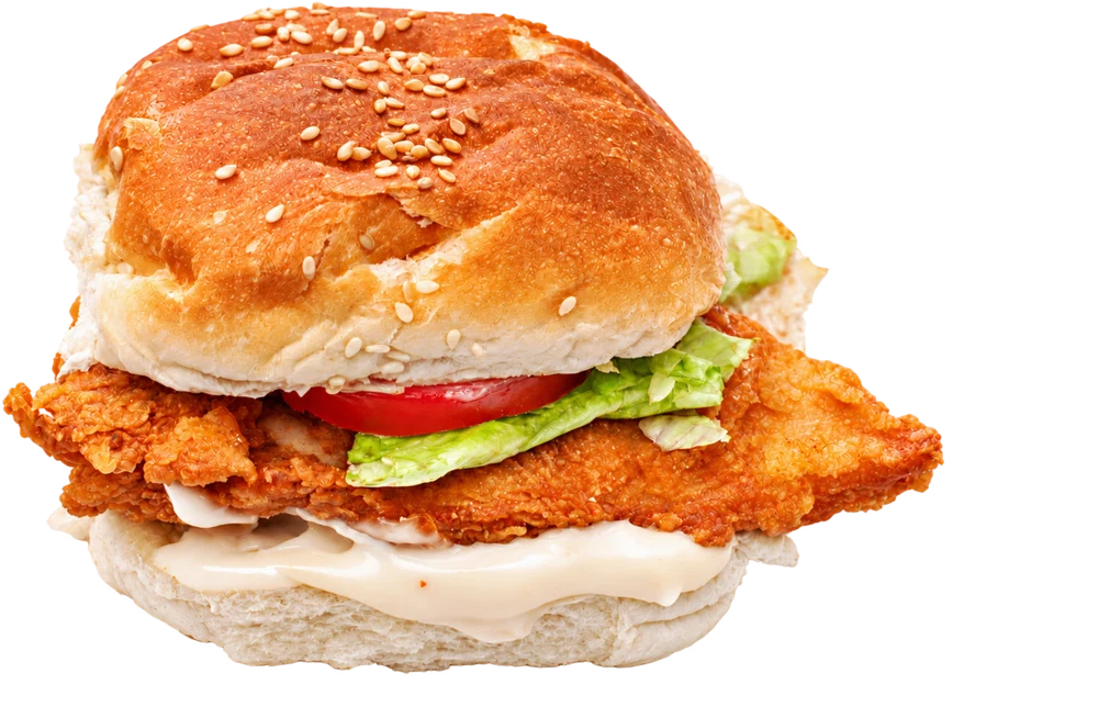 Cheekies crunchy chicken fillet burger with lettuce, tomato and creamy mayo on a sesame bun