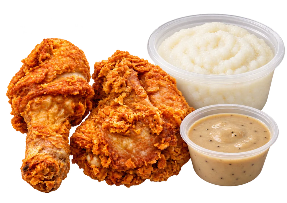 Two pieces of Cheekies fried chicken with a tub of pap and a tub of gravy